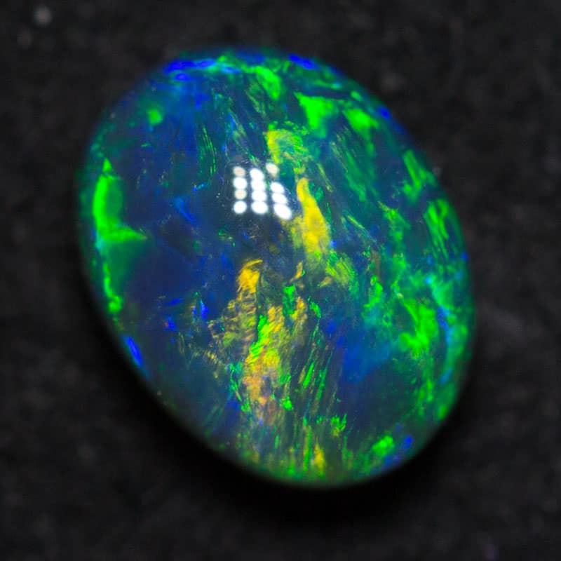 0.77 ct black opal 6.5x5x4mm