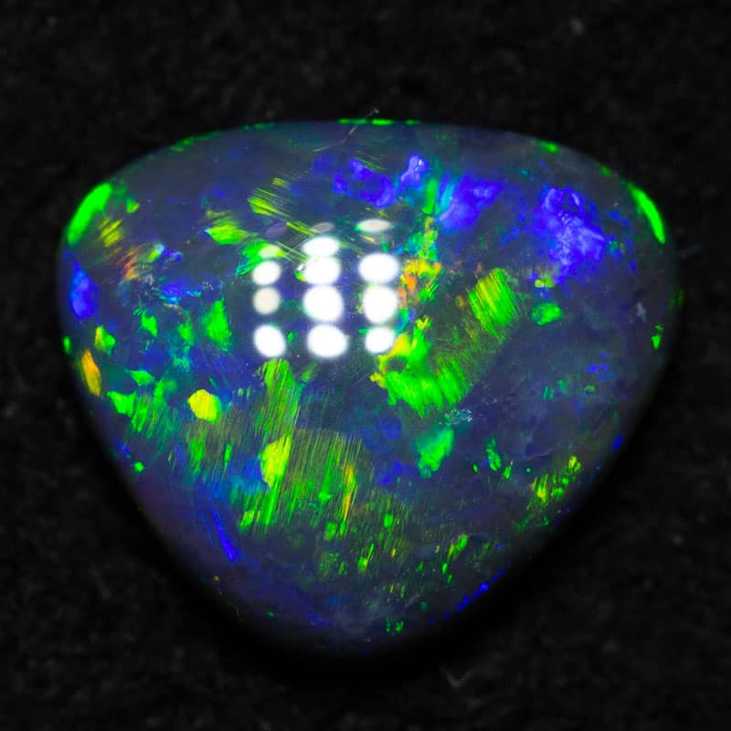 0.77 ct black opal 7.6x6.5x2.6mm