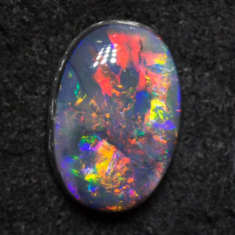 0.77 ct dark opal 7.1x4.8x3.3mm