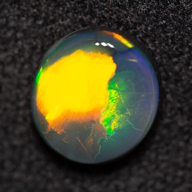 0.79 ct black opal 6.9x6.4x2.5mm