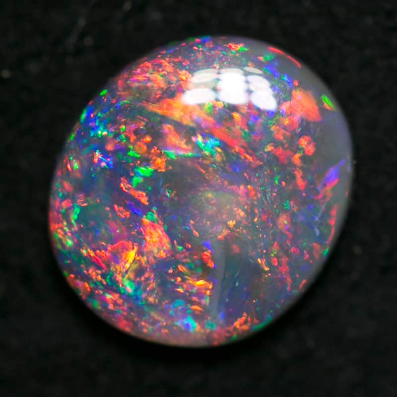 0.79 ct dark opal 7x6.5x2mm