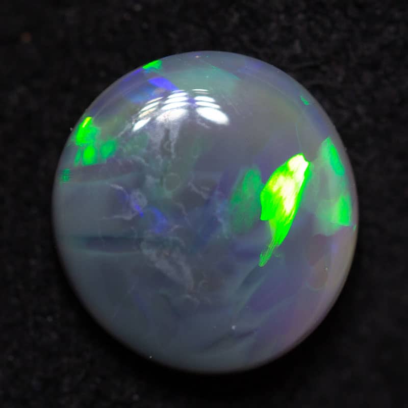 0.79 ct dark opal 7x6.7x2.4mm