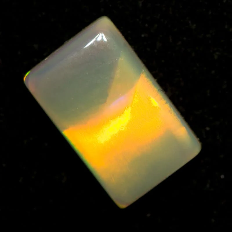 0.79 ct dark opal pillow cut with cats eye pattern 8x5x2mm