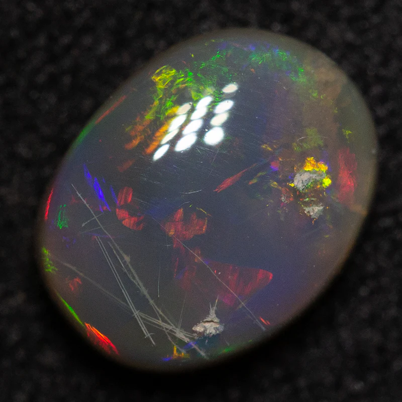 0.80 ct dark opal 7.3x5.6x3.1mm