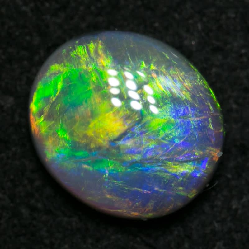 0.80 ct dark opal 7x6x2.5mm