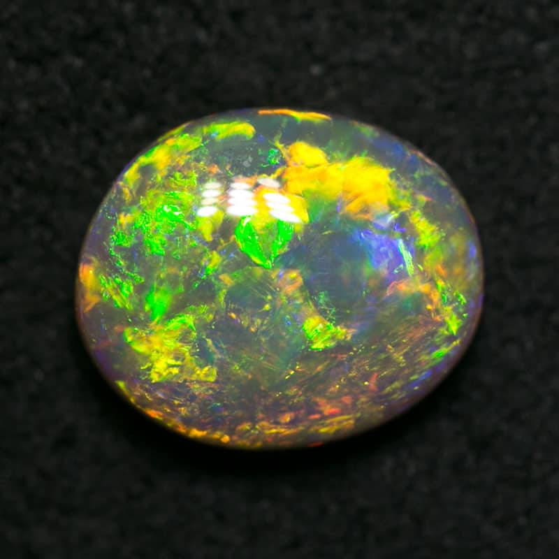 0.81 ct dark opal 7x6x3mm