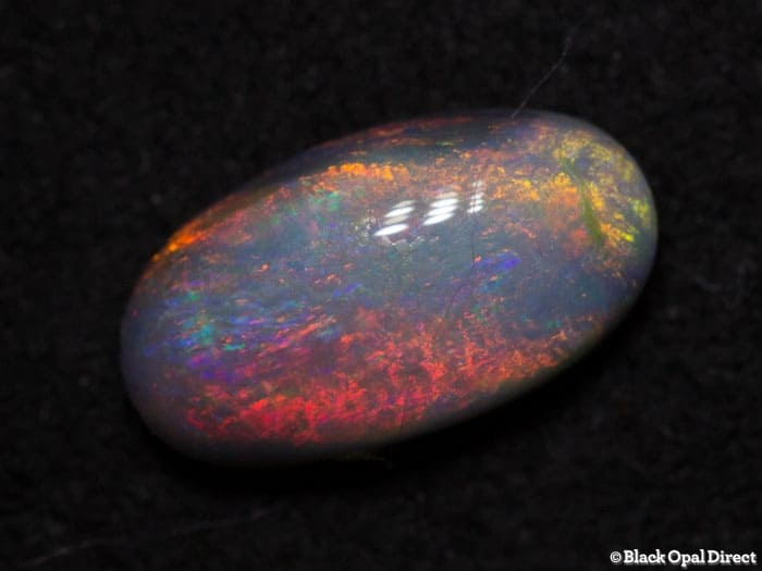 0.81 ct semi black opal 9x5x3mm