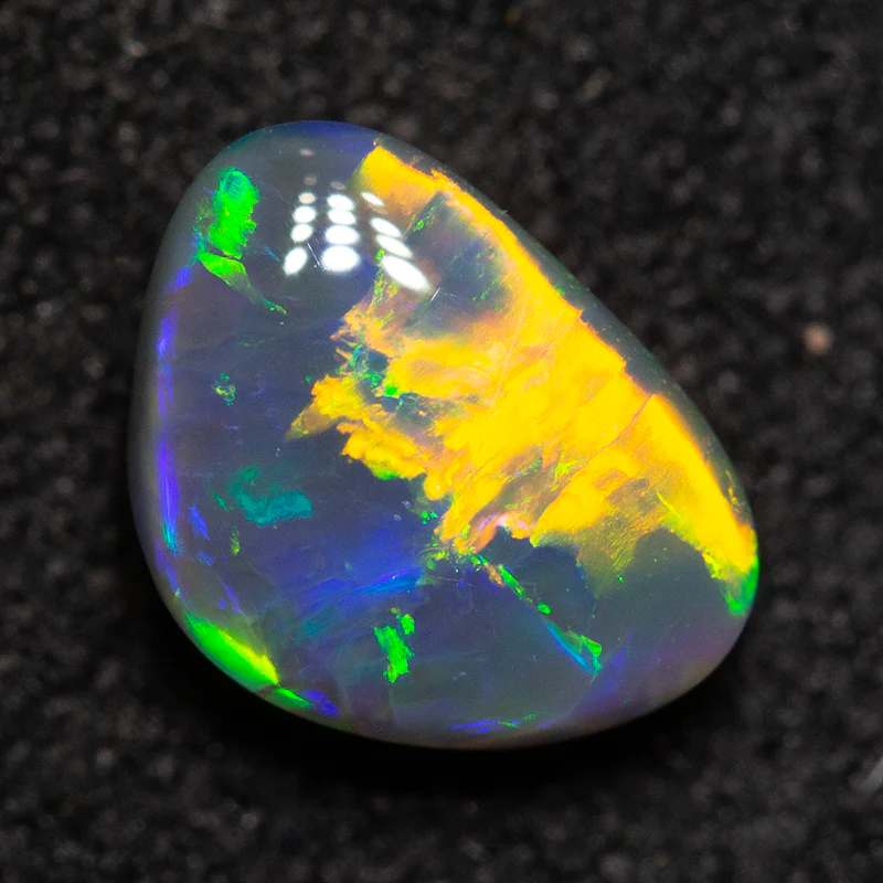 0.82 ct black opal 7.1x5.2x3.3mm