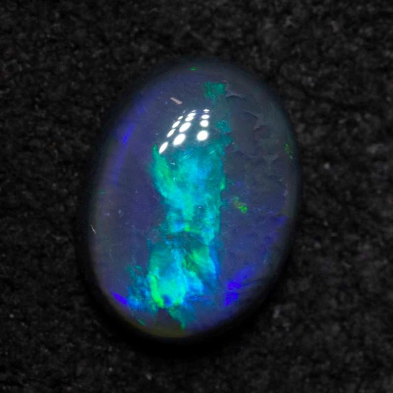 0.82 ct black opal 7.1x5.3x3.1mm