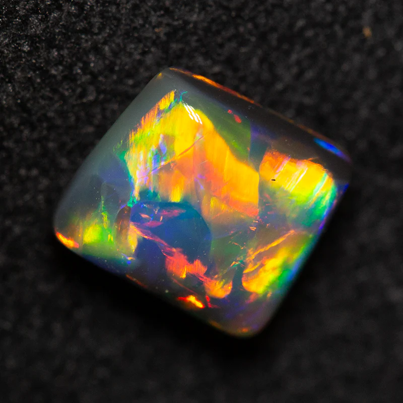 0.82 ct double-sided black opal 6.1x5.4x3.4mm
