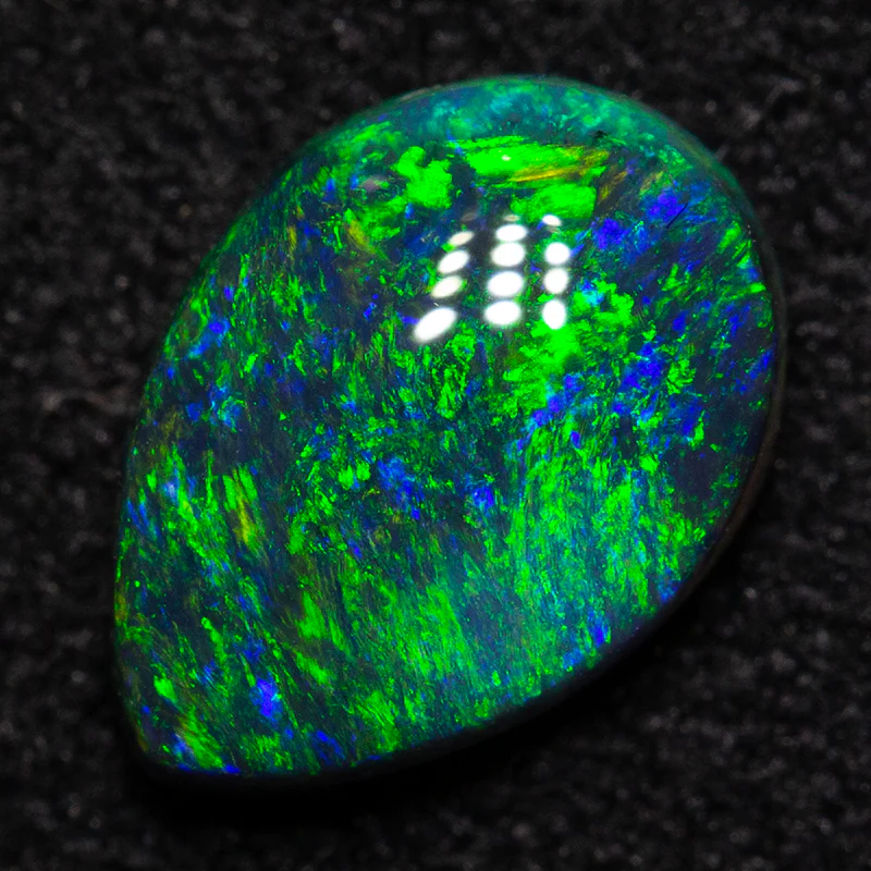0.83 ct black opal 8.3x5.9x3mm