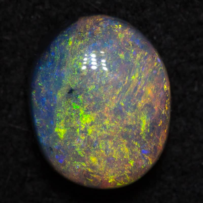 0.83 ct dark opal 6.7x5.6x3.1mm