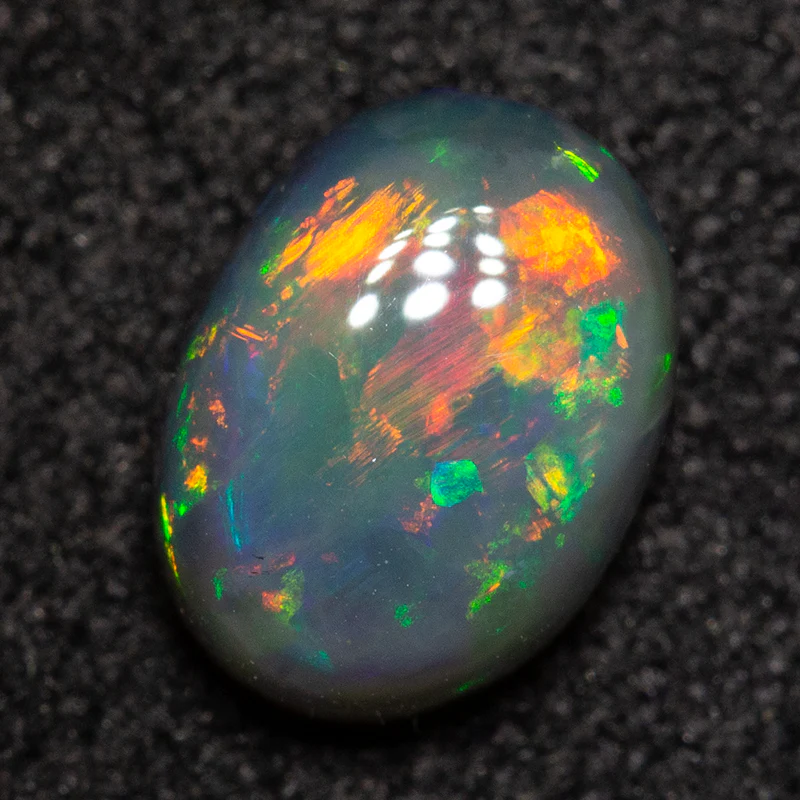 0.83 ct dark opal 6.9x5.1x3.2mm