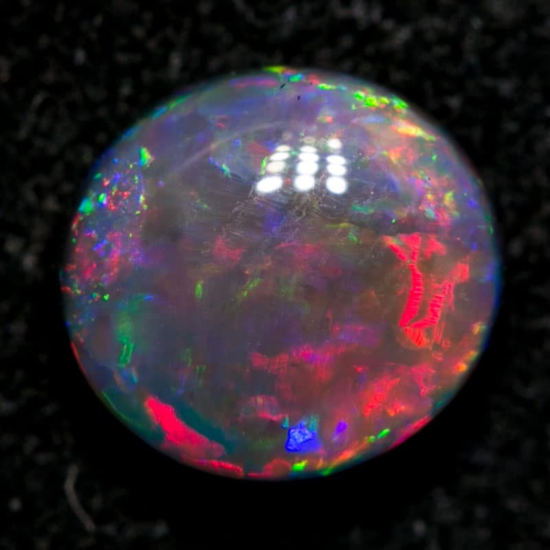 0.84 ct black opal gem 6.3x6x3mm