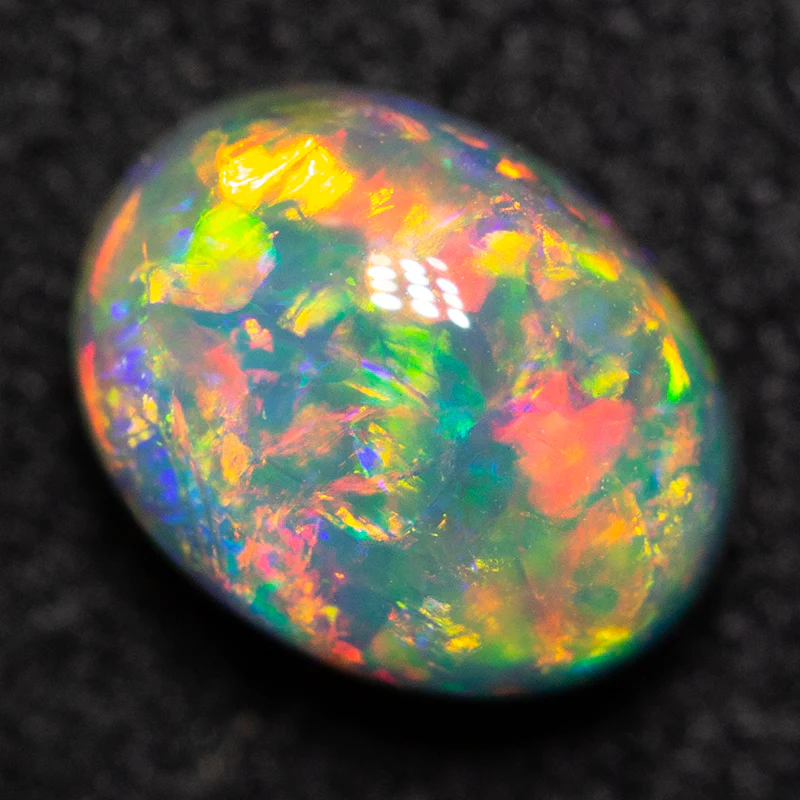 0.84 ct dark opal 6.8x5.3x3.8mm