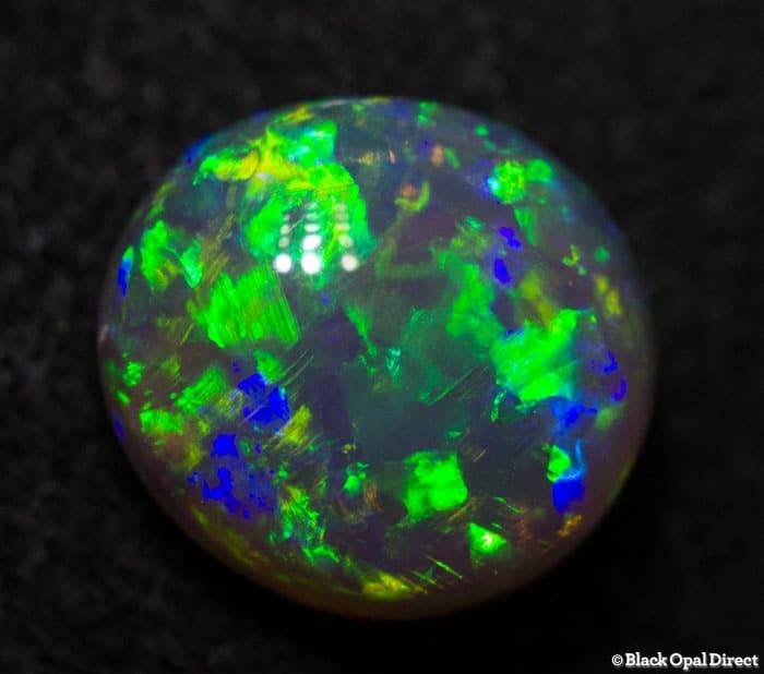 0.84 ct gem green dark crystal opal 7x6x3.5mm
