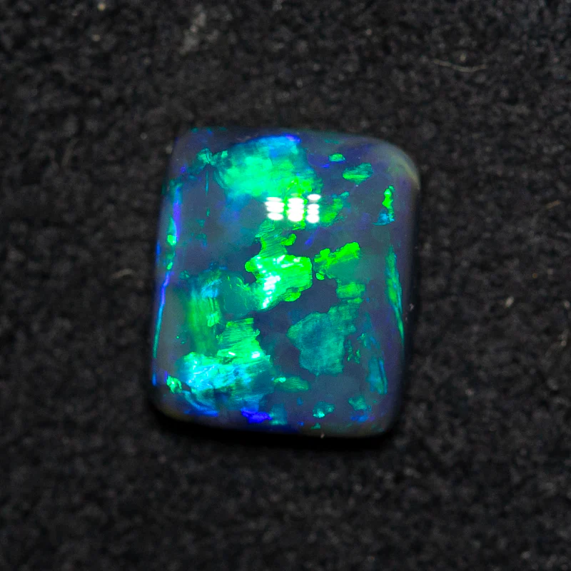 0.85 ct black opal 6.7x5.8x2.9mm
