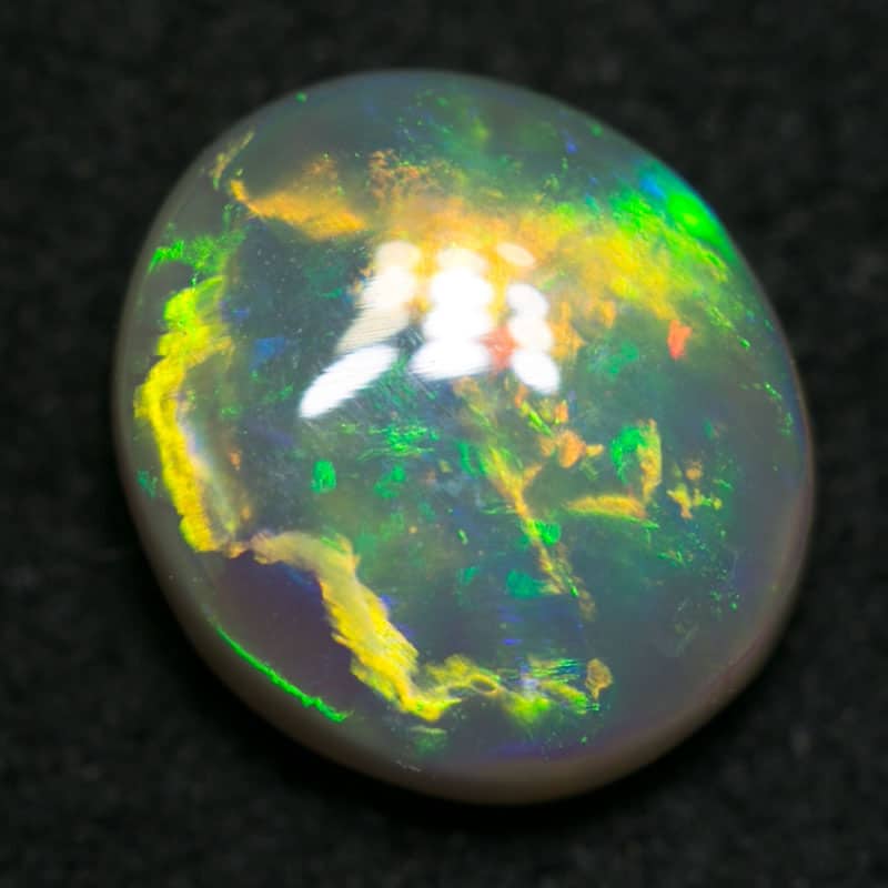 0.85 ct dark crystal opal 7x6x3mm
