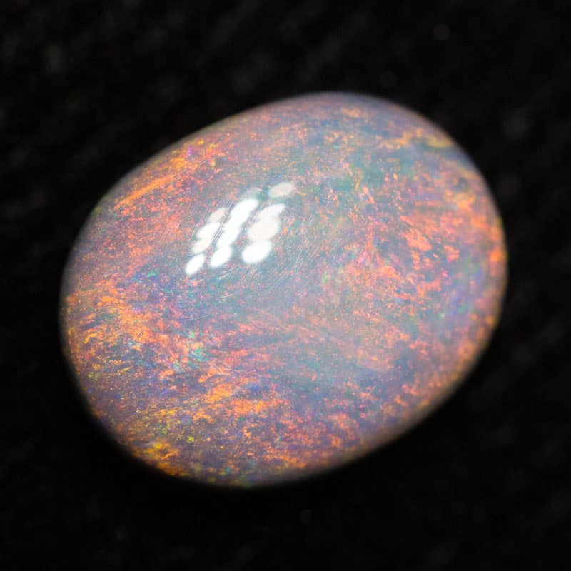 0.85 ct dark opal 7.5x6x3mm