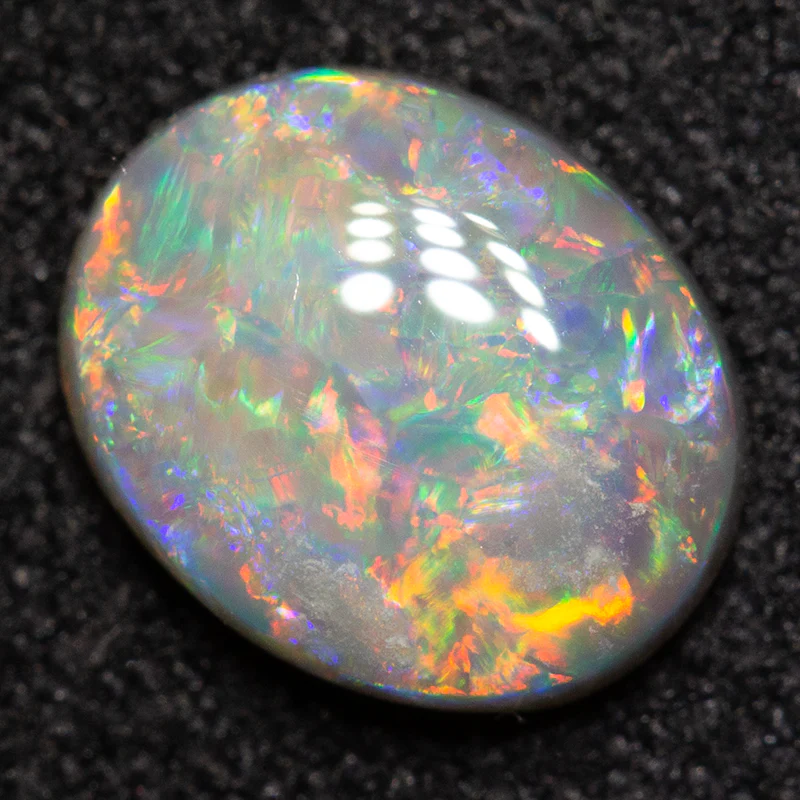 0.85 ct dark opal 7.8x6.3x2.6mm
