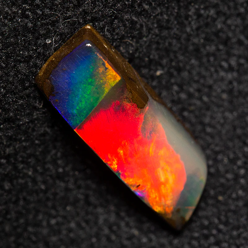 0.86 ct boulder opal 10.2x3.5x2.3mm