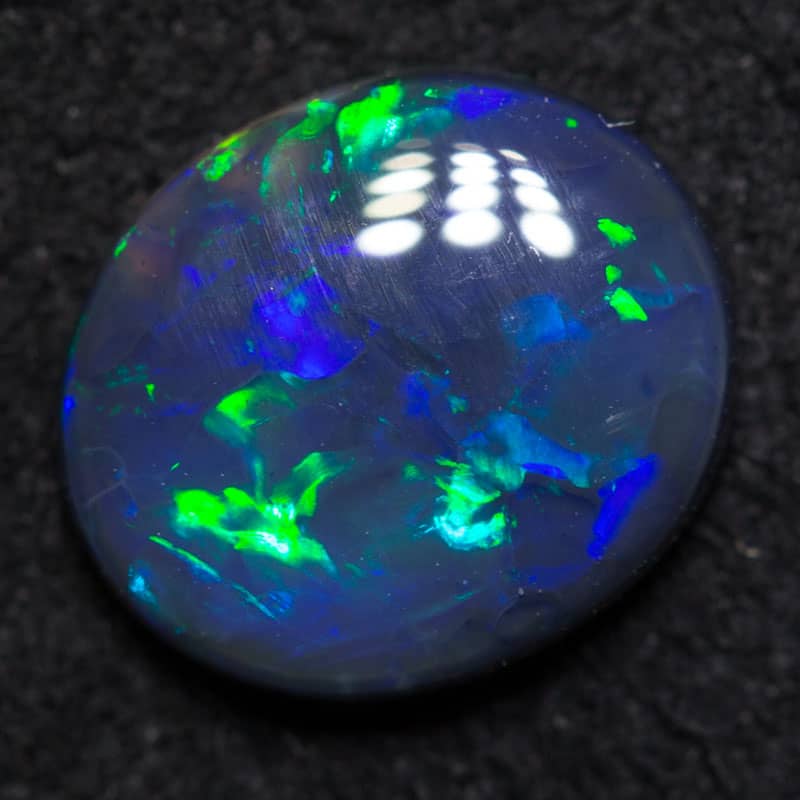 0.87 ct black opal 8x6.9x2.5mm