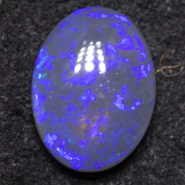 0.88 ct black crystal opal 7.7x5.8x3.1mm