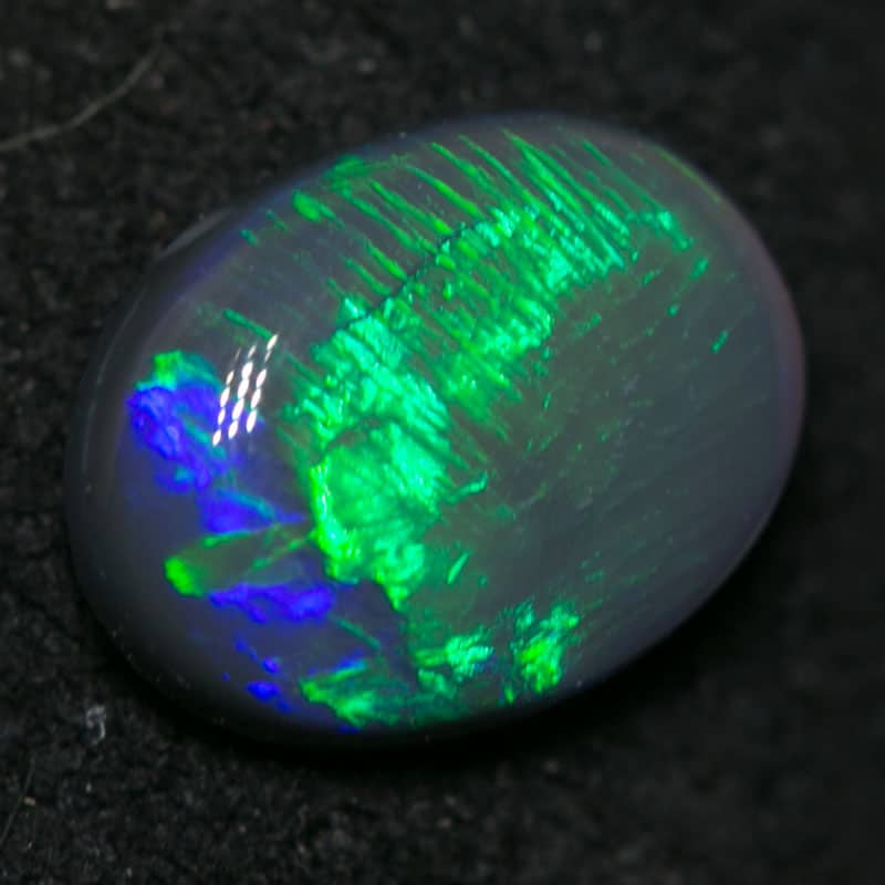 0.88 ct black opal 7x6x3mm