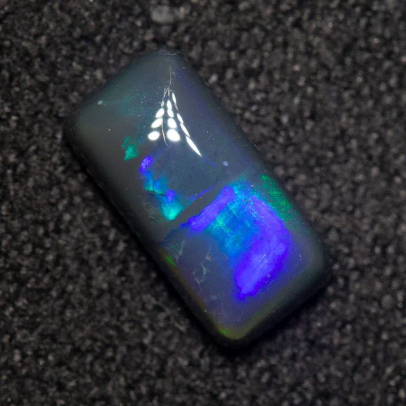 0.88 ct black opal 8.5x4.2x3mm