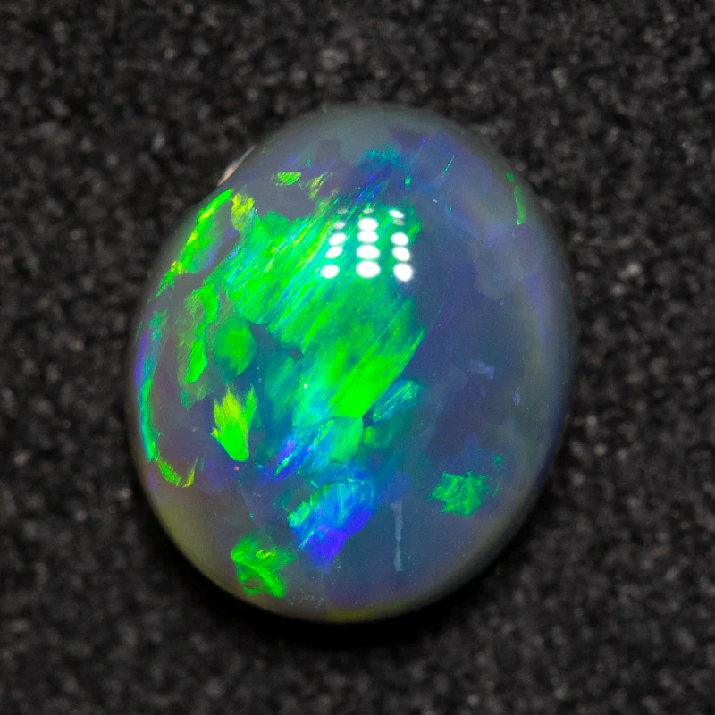 0.88 ct black opal 7x6.1x3.2mm