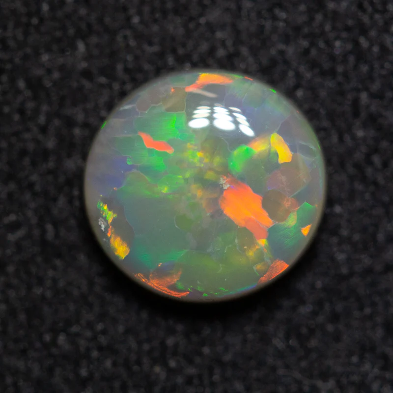 0.88 ct dark opal 6.8x6.5x2.8mm