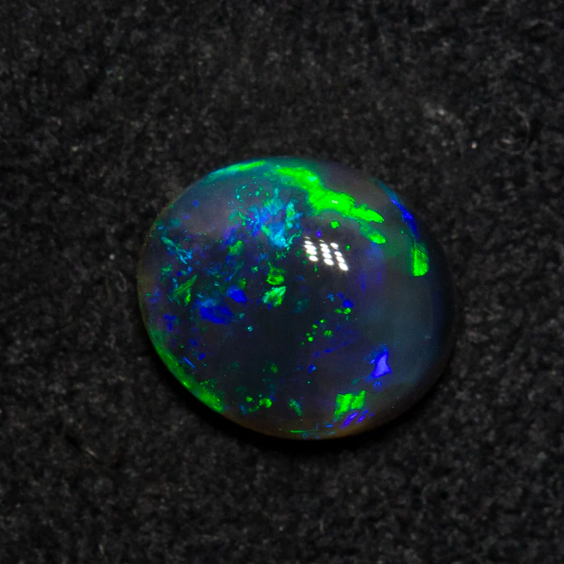 0.89 ct black opal 7x6.1x3.4mm