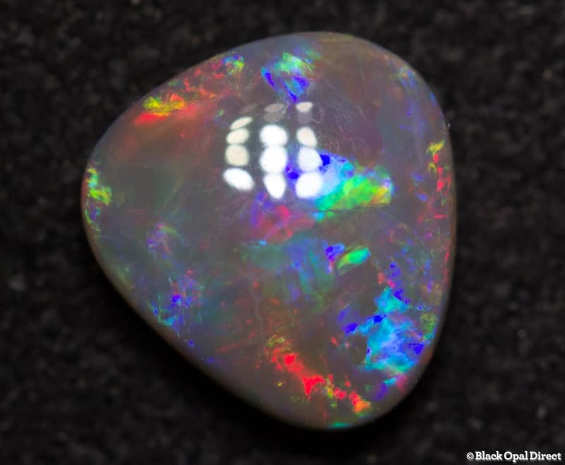 0.90 ct baroque semi black opal 7x7x3mm