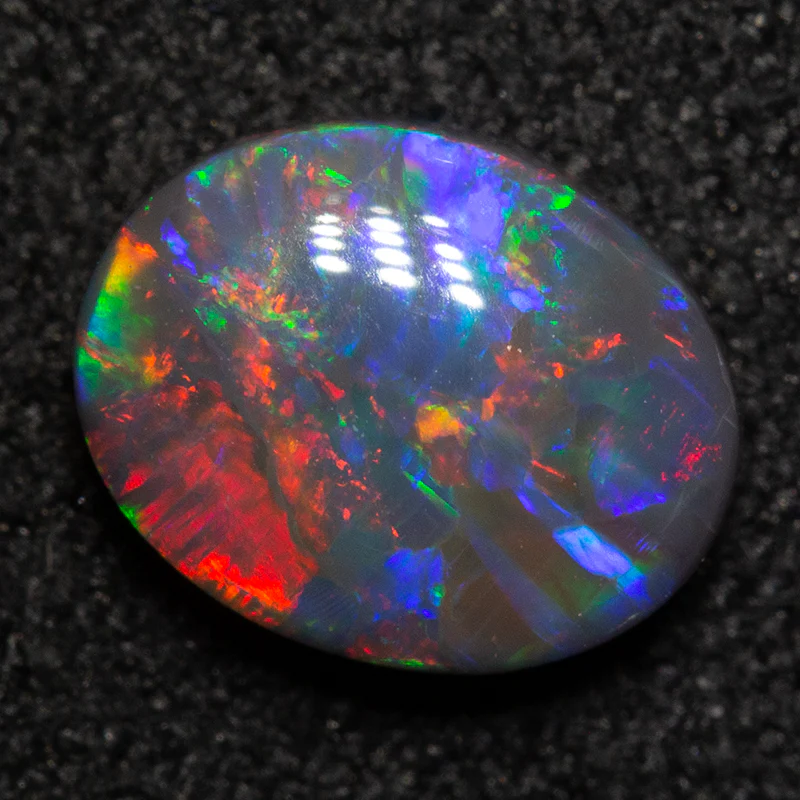 0.91 ct black opal 7.6x6x3mm