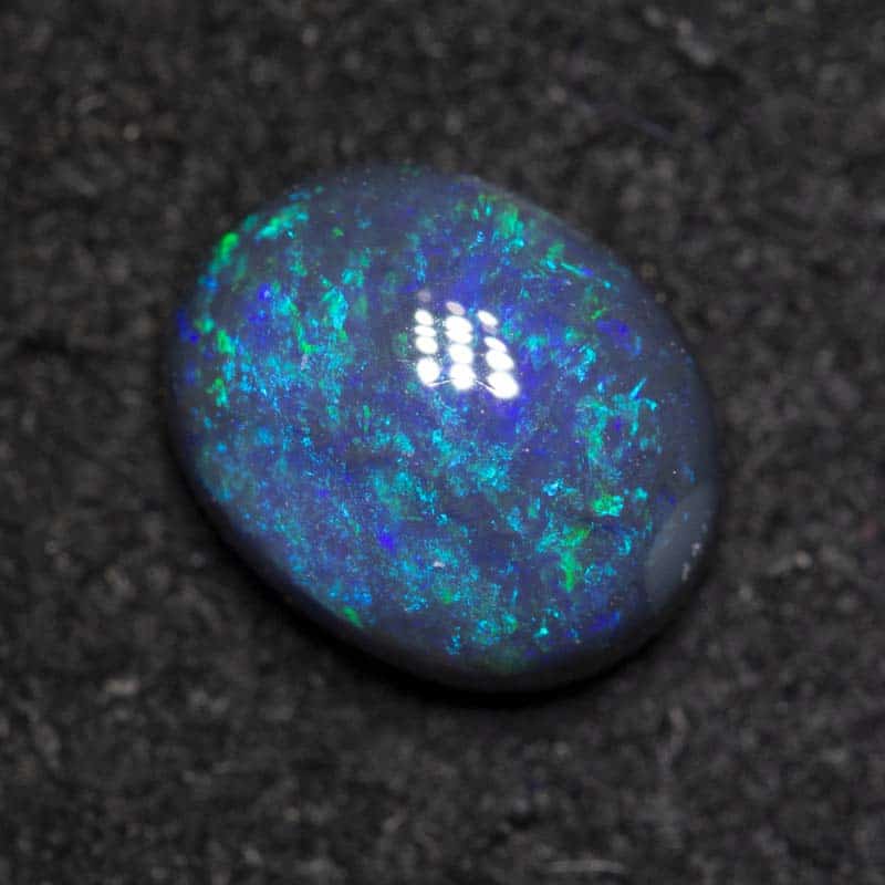 0.93 ct black opal 7.2x5.8x3.3mm