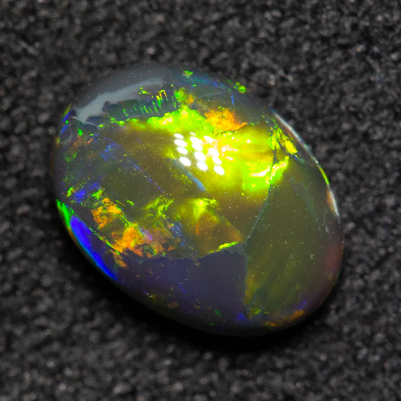 0.93 ct black opal 7.6x5.6x3.5mm