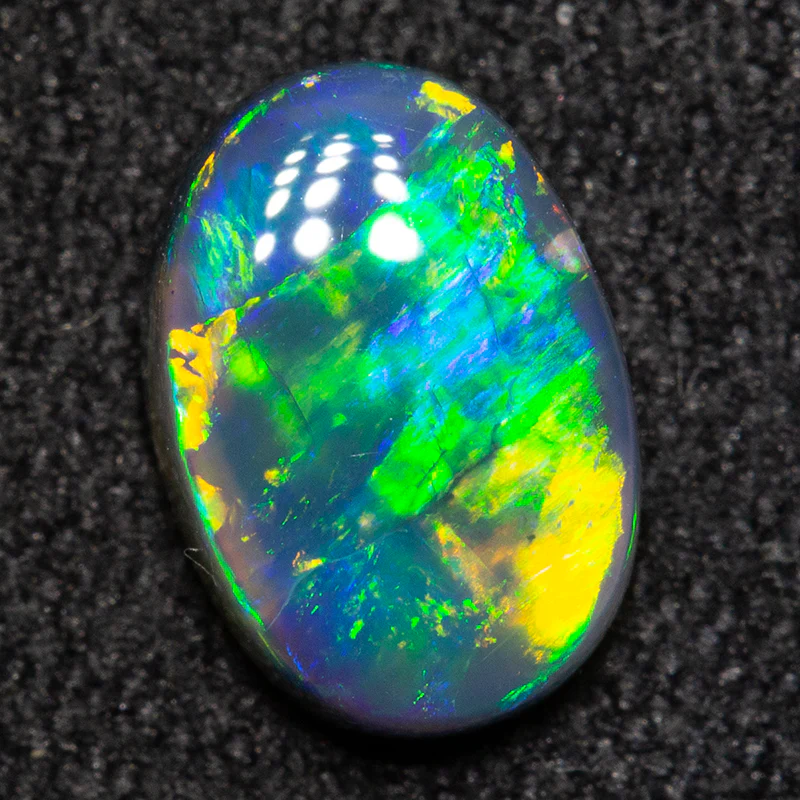 0.94 ct black opal 8x5.6x2.9mm