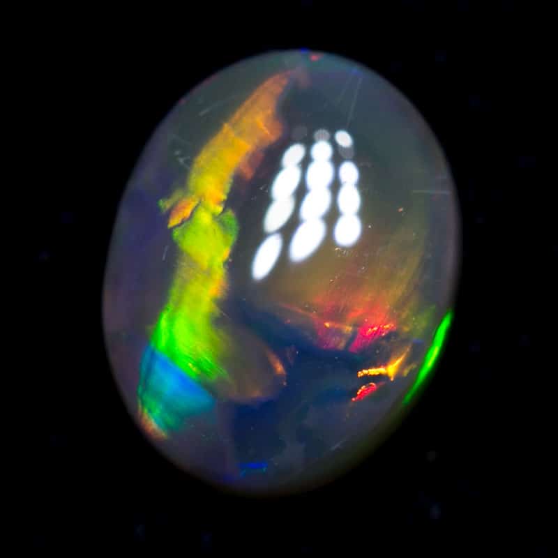 0.95 ct dark opal 7.5x6x3mm