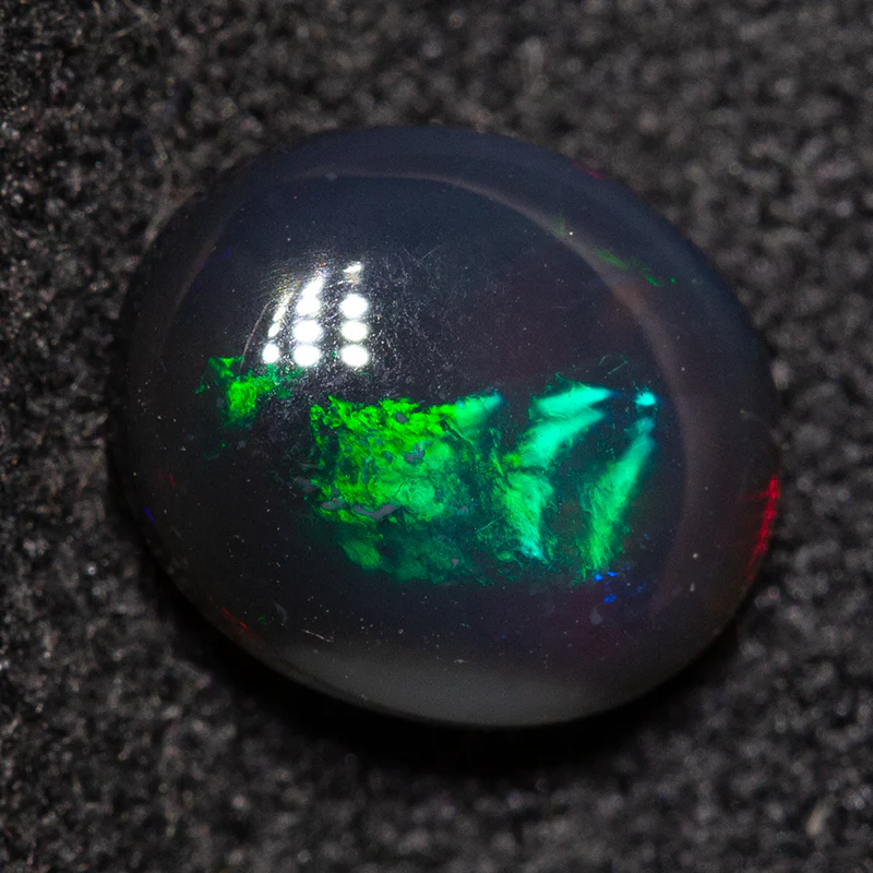 0.96 ct black opal 7.2x6.1x3.4mm