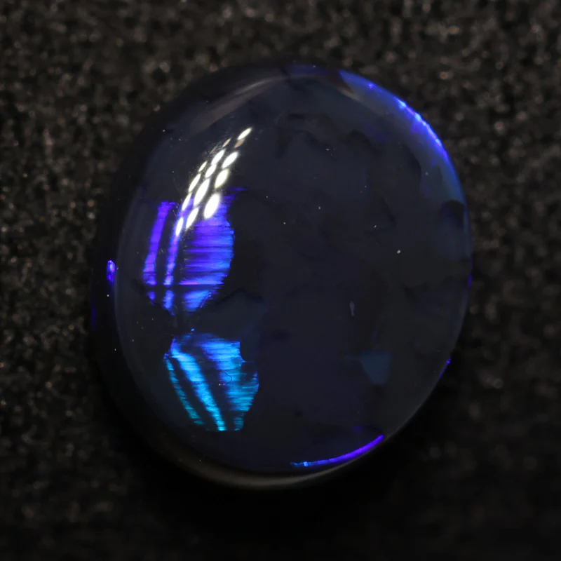 0.97 ct black opal 7.2x6.3x3.2mm