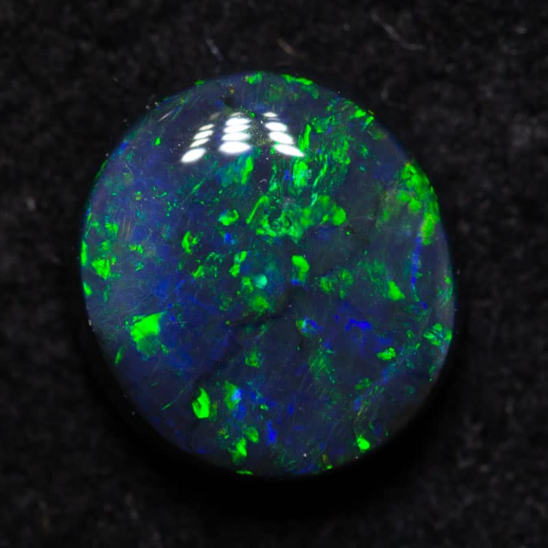 0.97ct black opal 6.9x6.4x3.1mm
