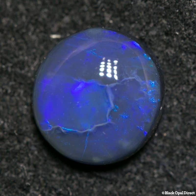 0.98 ct black opal 7x6.5x3mm