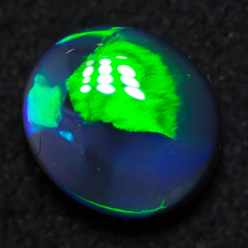 0.98 ct black opal 7x6x3mm