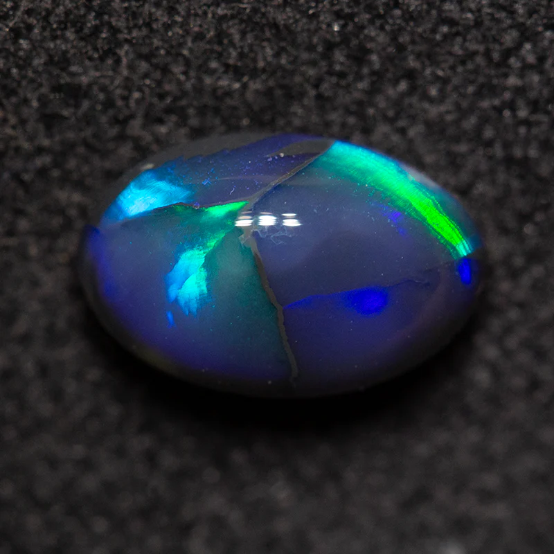 0.98 ct black opal 8.1x5.2x3.5mm