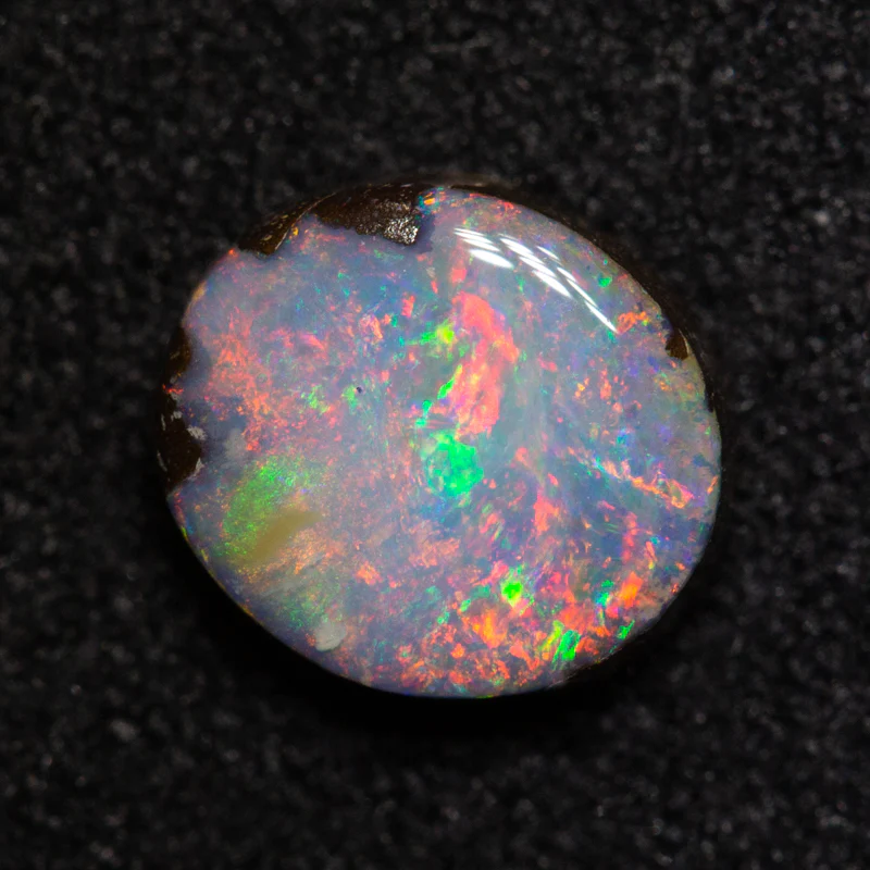 0.98 ct boulder opal 6.9x6.1x2.7mm