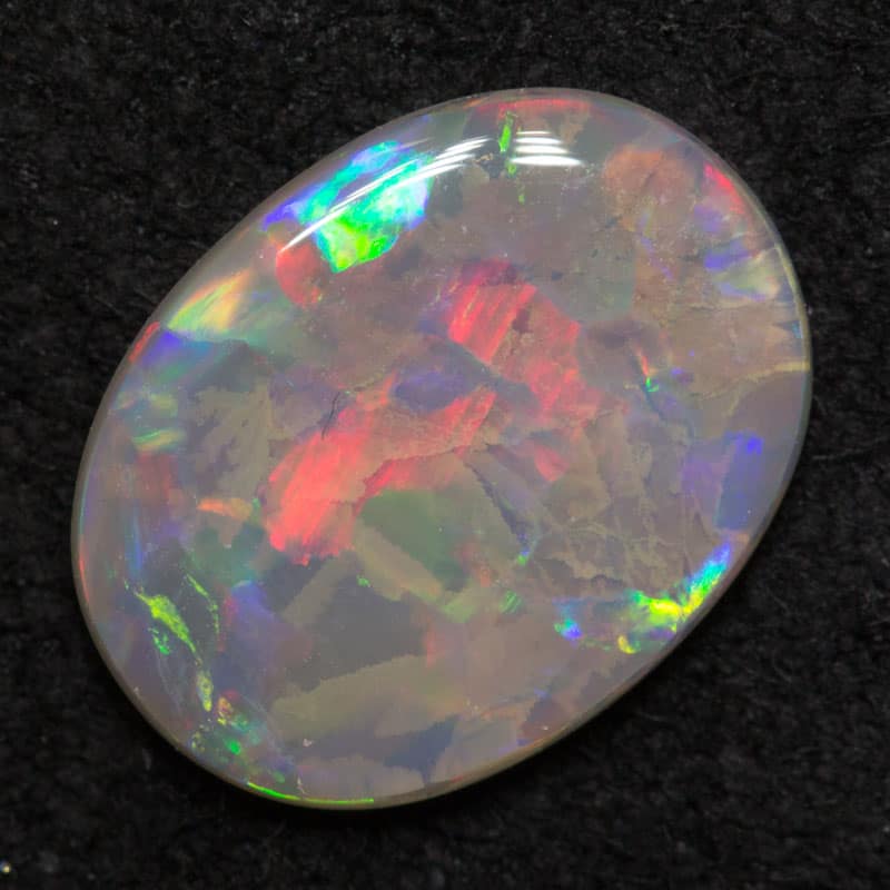 0.98 ct dark opal 10.4x7.9x1.9mm