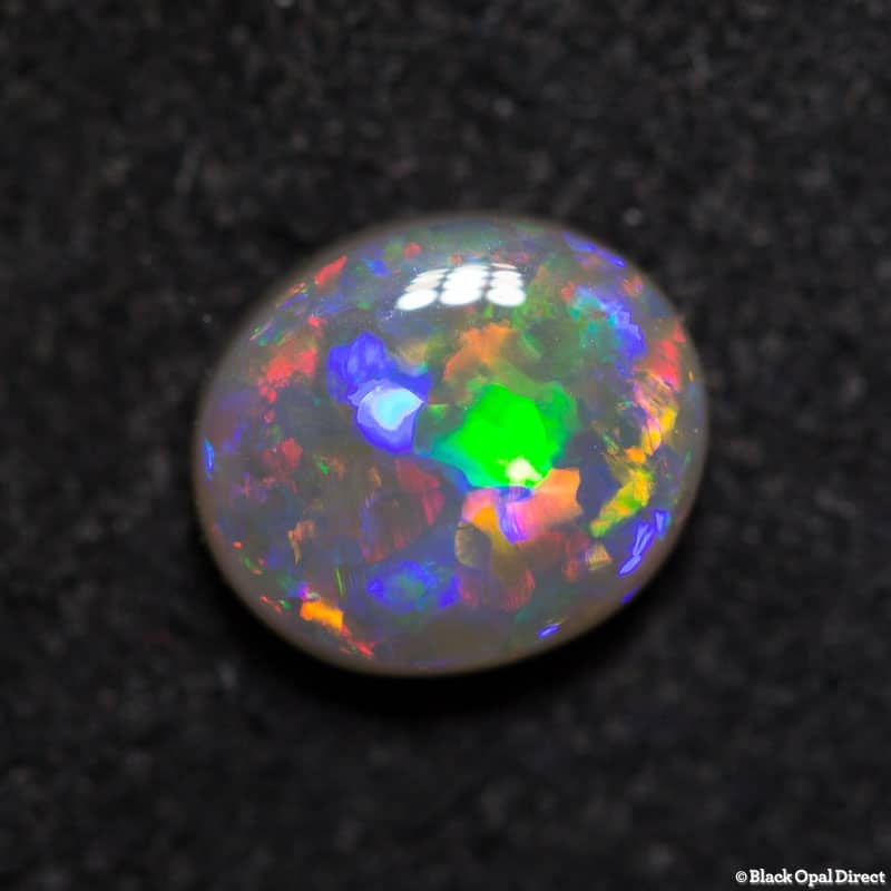 0.98 ct semi black opal 7x6x3mm