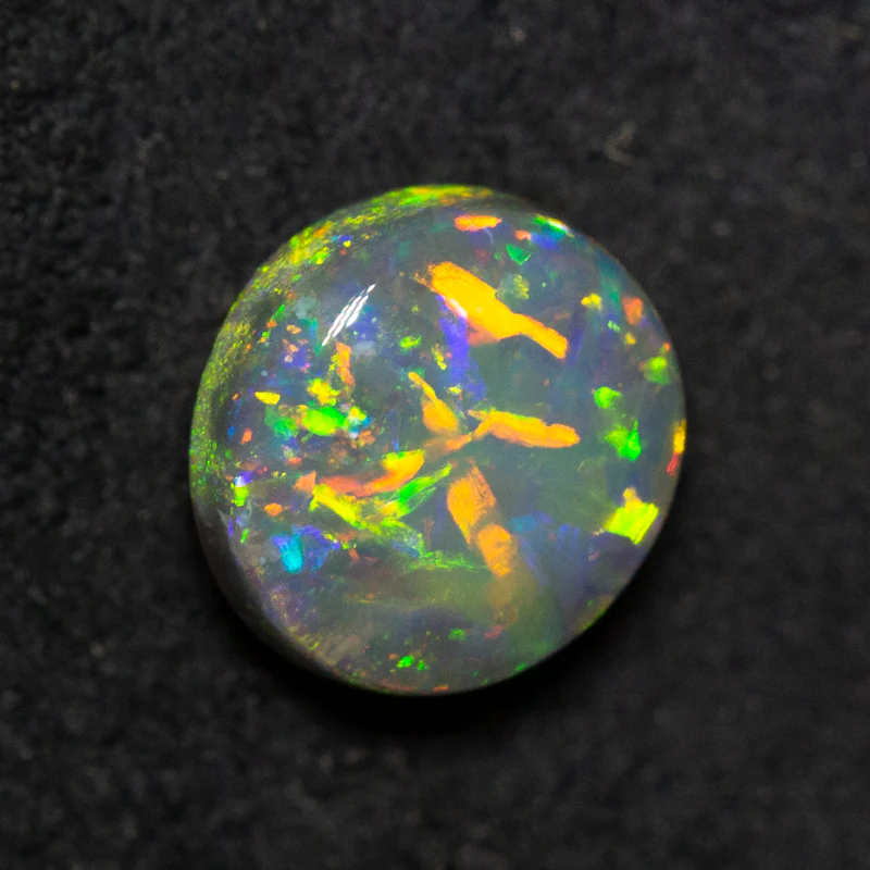 0.99 ct black opal 6.9x6.4x3.6mm