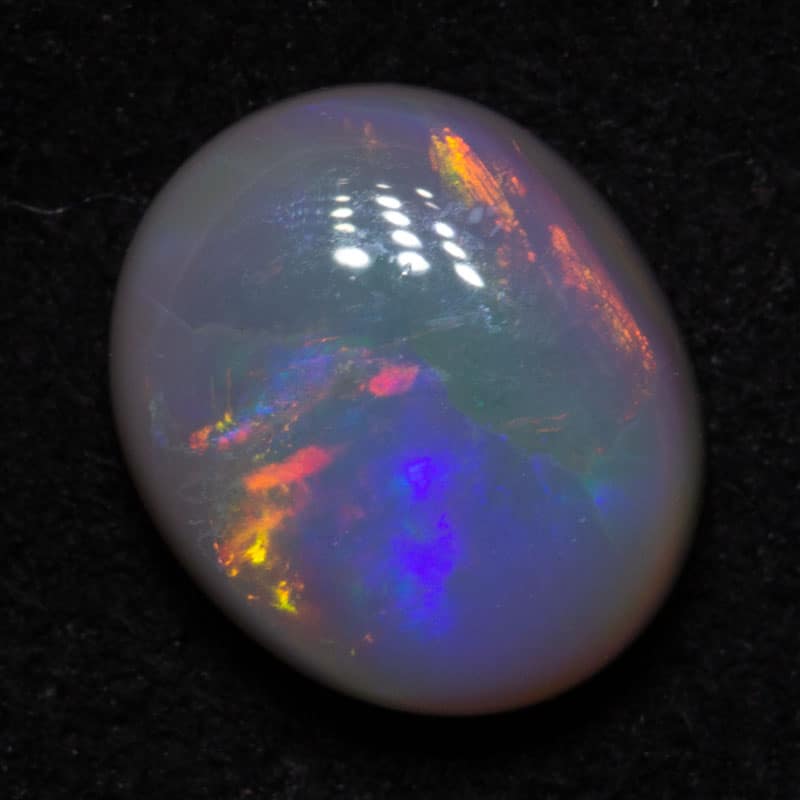 0.99 ct dark opal 7.5x6.3x3mm