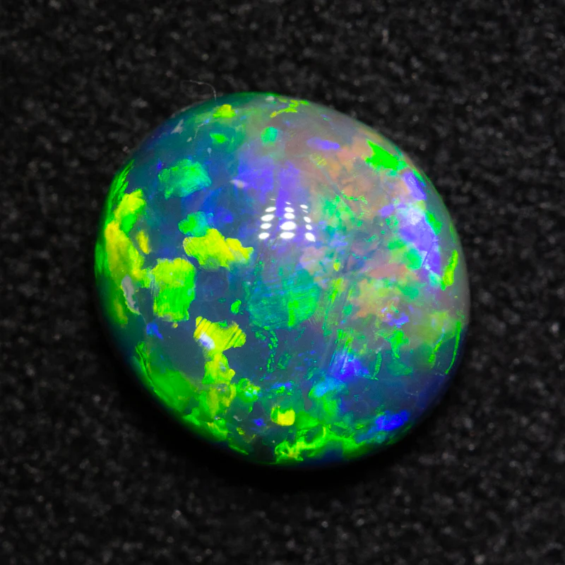 1.01 ct black opal 7.2x6.5x3.6mm